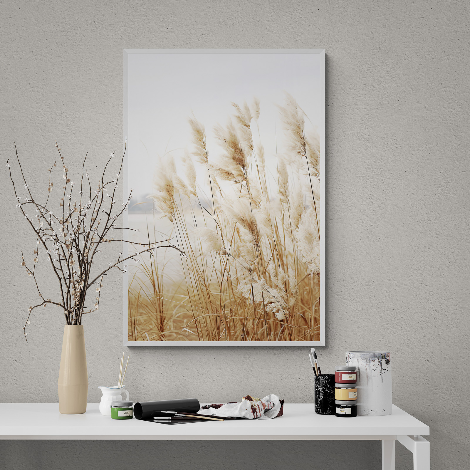 Dried Grass Neutral Botanical Prints Set of 3 wall art in an art studio with a flowering plant