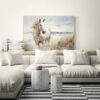 Running Horse on the Beach Wall Art - 3x2 Aspect Ratio - Natural Wood Floating Frame Canvas in a Minimalist Comfy Living Room with Sectional Sofa and Tree Stump Pedestals