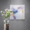 Whispering Shades of Purple I - Acrylic on Canvas - 24x24 - Natalie Bell, April 2024 - White Floating Frame - Colorful flowers next to sunlit wall