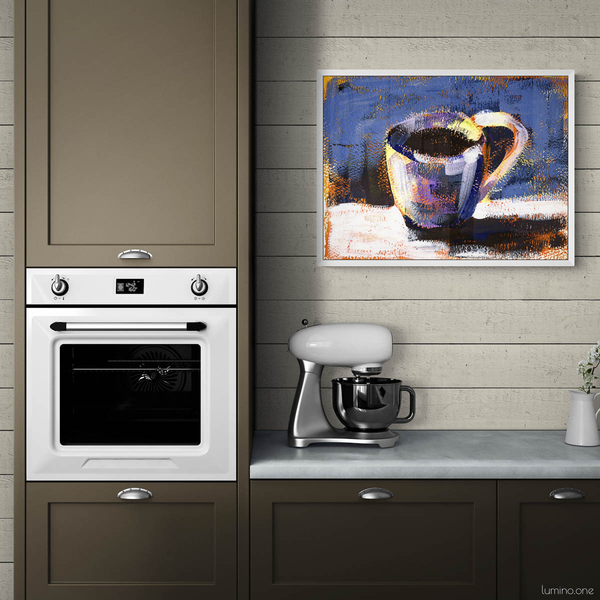 Coffee cup painting in white frame displayed in modern sage green kitchen with shiplap walls. Impressionist style coffee art with deep blue background hanging above countertop with stand mixer. Cozy kitchen wall decor featuring mug artwork perfect for coffee bar area, breakfast nook, or dining room. Artwork complements contemporary kitchen with white appliances and green cabinetry.
