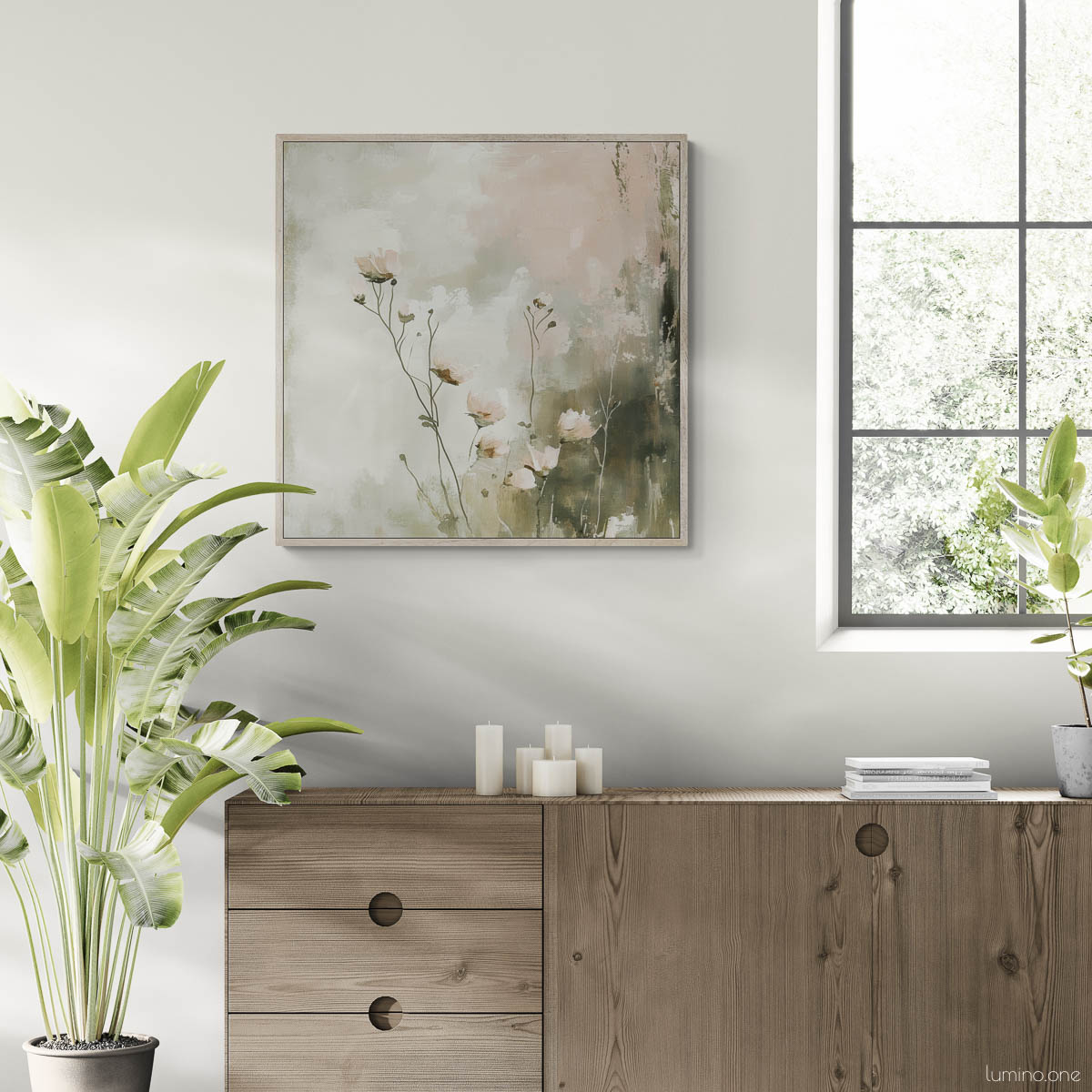 Botanical canvas print featuring sage green wildflowers in silver float frame, displayed above natural wood sideboard in bright Scandinavian dining room with large arched window, bird of paradise plant, and neutral tile flooring