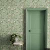 Chinoiserie Bird Wallpaper Peel and Stick - Sage Green Botanical Sage green chinoiserie removable wallpaper with hand-painted birds, pink peonies, and botanical branches in entryway with matching sage green door, round gold side table, pothos plant, and jute rug