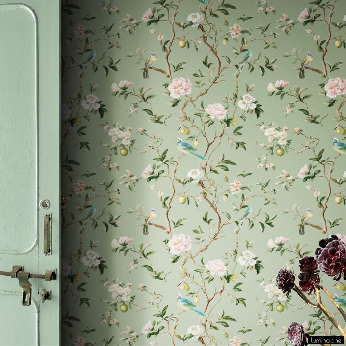 Chinoiserie Bird Wallpaper Peel and Stick - Sage Green Botanical Sage green chinoiserie peel and stick wallpaper with hand-painted birds, pink peonies, white blossoms, and lemon branches next to vintage mint green door with dried burgundy flowers