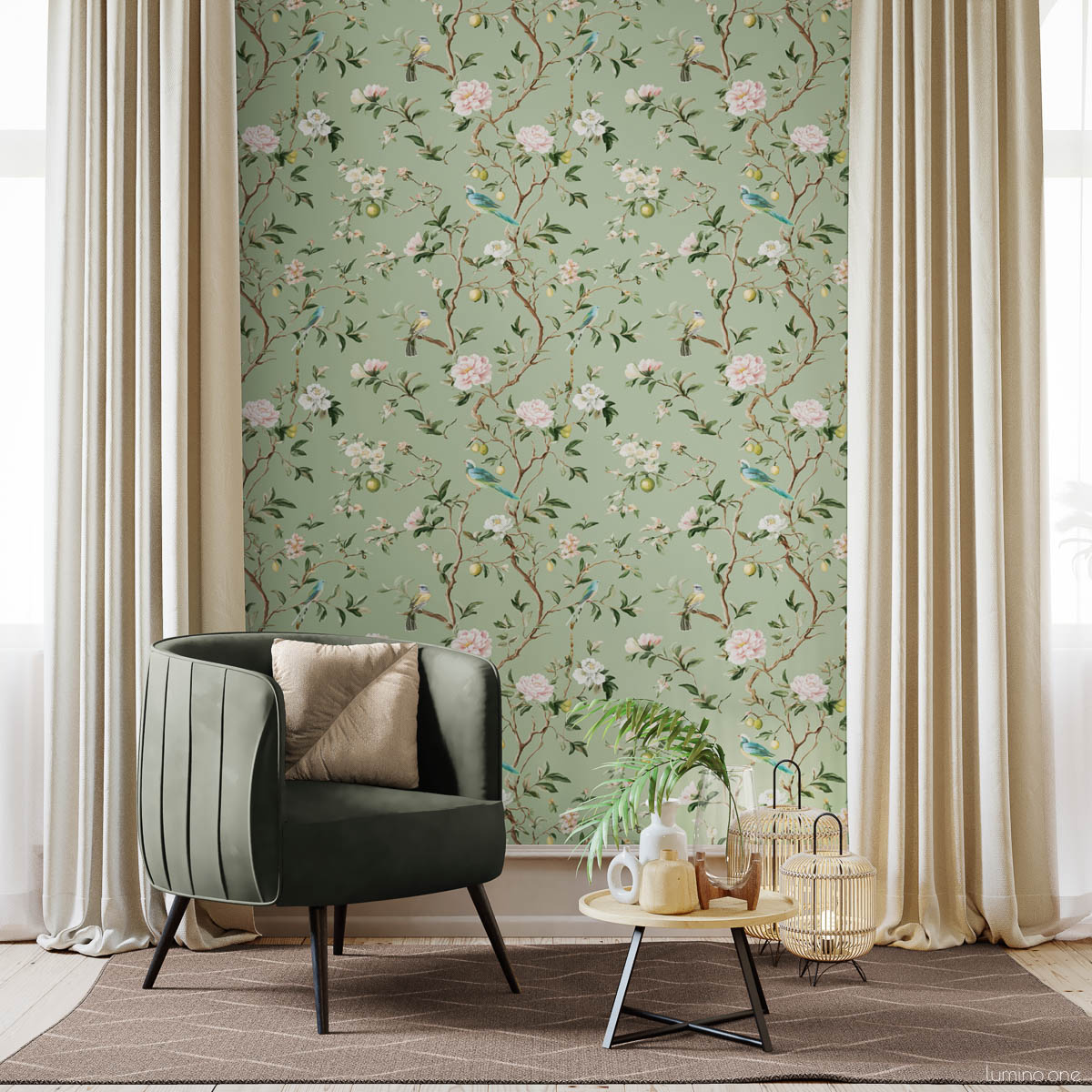 Chinoiserie Bird Wallpaper Peel and Stick - Sage Green Botanical Sage green chinoiserie botanical wallpaper feature wall with hand-painted birds, pink peonies, and lemon branches in bright room with green velvet chair, gold pillow, beige curtains, and natural wood coffee table