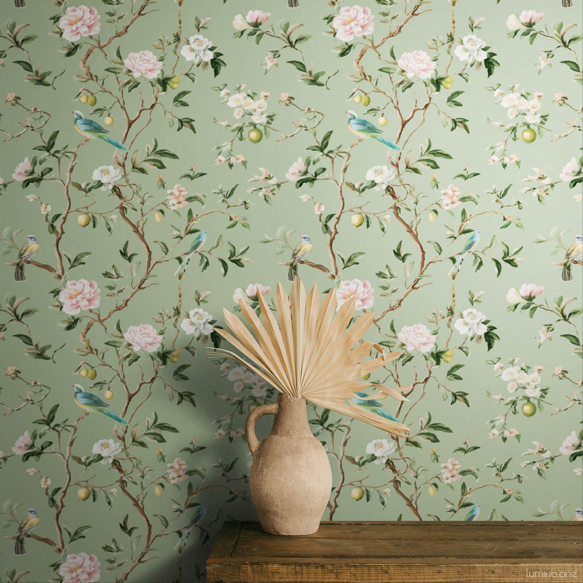 Chinoiserie Bird Wallpaper Peel and Stick - Sage Green Botanical Sage green chinoiserie peel and stick wallpaper featuring hand-painted birds, pink peonies, white blossoms, and lemon branches on botanical background, styled in bedroom with dried palm leaf decor