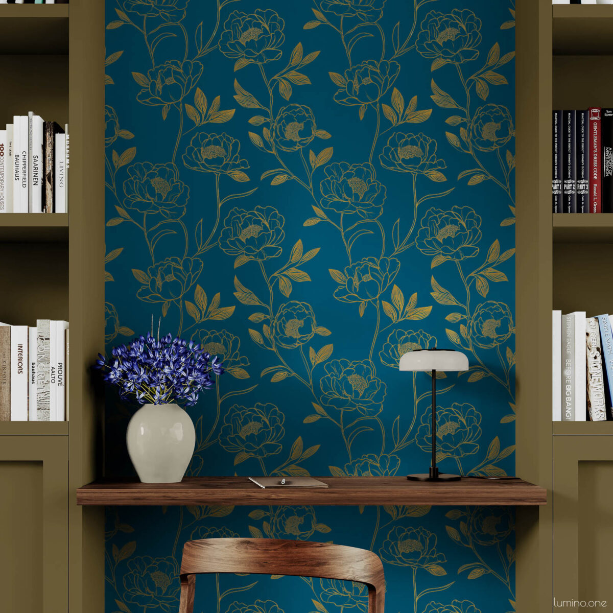 Cozy home office nook with dark teal and gold botanical peony peel and stick wallpaper framed by olive green built-in bookshelves, styled with a walnut floating desk, black leather chair, and white vase of purple agapanthus on wood floors